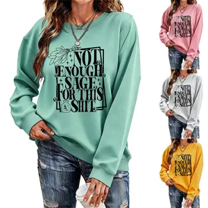 Close-up detail of the graphic long sleeve sweatshirt showing print and color variants.