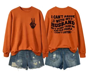 Casual women's orange long sleeve sweatshirt featuring front graphic and funny back text detail.