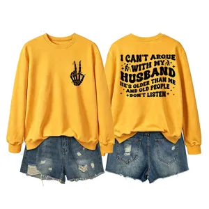 Casual women's yellow crewneck long sleeve sweatshirt paired with stylish denim shorts.