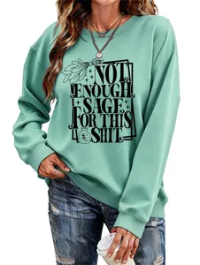 Detailed view of women casual long sleeve sweatshirt in light green with funny slogan print.