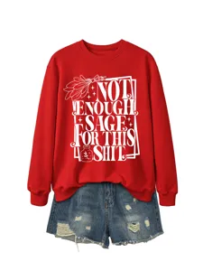 Women's red long sleeve crewneck sweatshirt paired with denim shorts, casual autumn style.