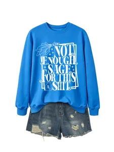 Comfortable blue long sleeve sweatshirt with funny sage text paired with distressed denim shorts.