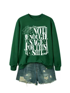 Green casual long sleeve sweatshirt with funny sage text paired with denim shorts for women.