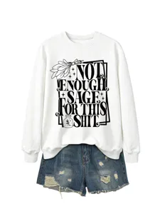 Close-up detail of white crewneck long sleeve sweatshirt featuring funny typography graphic print.