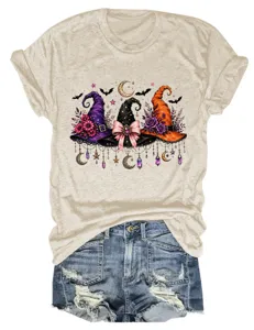 Detailed view of women's short sleeve t-shirt with witch hats graphic and denim shorts.
