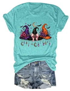 Women turquoise short sleeve t-shirt with Halloween witch hats graphic and denim shorts.