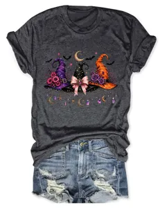Detail of dark gray t-shirt with Halloween witch hats, bats and moon print design.