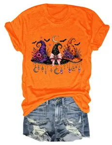 Close-up details of the vibrant orange short sleeve t-shirt featuring festive Halloween witch hats.