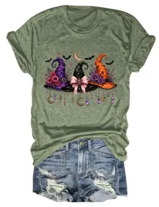 Detailed view of the women graphic tee featuring magical witch hats, moon, and stars print.