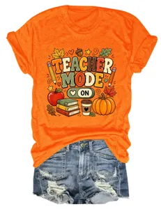 Gedetailleerd detail van het oranje t-shirt met korte mouwen en herfst leraar print.