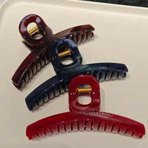 Large hair claw clip detail shot, elegant acrylic shark clip in multiple colors for women daily styling.