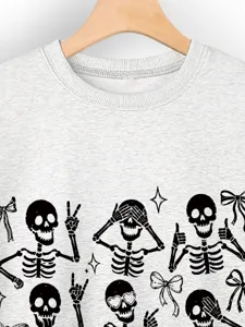 Detailed view of women's casual Halloween sweatshirt with cute skeleton print and bow details.