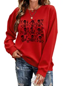 Close-up detail view of the red sweatshirt featuring unique black skeleton and cute bow graphic.