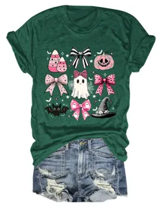 Women's cute pink Halloween ghost graphic t-shirt paired with casual denim shorts.