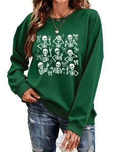 Women's green long sleeve sweatshirt featuring cute skeleton and bow graphic for Halloween.