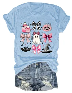 Close-up detail of the cute pink Halloween bow, ghost, and bat print on the light blue top.