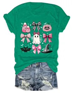 Green women's short sleeve t-shirt with cute pink Halloween ghost and bow graphic print.