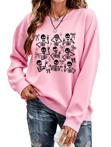 Close-up view of the cute skeleton graphic print on the casual pink crewneck sweatshirt.