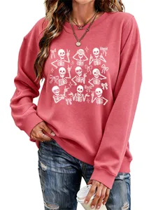 Women casual pink sweatshirt with skeleton and bow print, long sleeve round neck top.