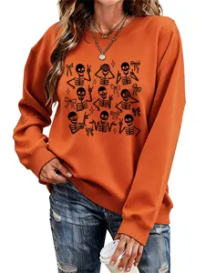 Orange crewneck sweatshirt for women featuring cute Halloween skeleton and bow graphic prints.