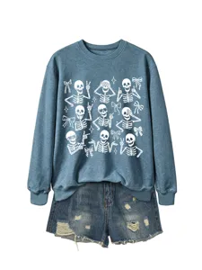 Blue skeleton print sweatshirt detail with cute Halloween graphic and matching denim shorts.