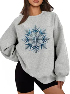 Casual grijze dames sweater met een sprankelend blauw glitter sneeuwvlok grafisch detail.