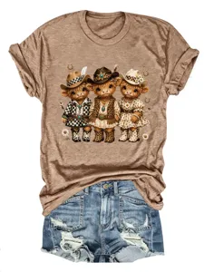 Maglietta marrone in cotone manica corta con stampa mucca cowboy e dettaglio di pantaloncini.