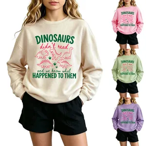 Detailed view of the cute dinosaur graphic sweatshirt featuring fun letter print design.