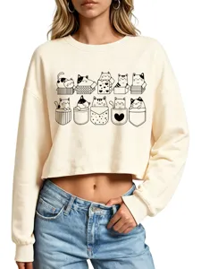 Close-up detail of the cute cat print and hem on the stylish beige crop sweatshirt for women.