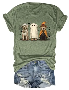 Close-up detail of women's olive green graphic t-shirt with halloween dogs and denim shorts.