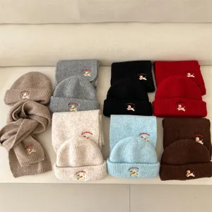 Detailed view of kids knit beanie hat and scarf set, soft warm winter children wool accessories.