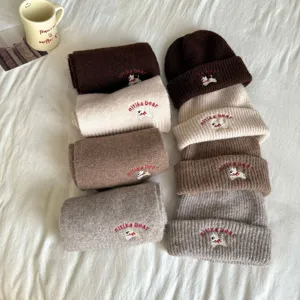 Detail of cute puppy embroidered knit beanie hat and scarf set, soft warm winter children wear