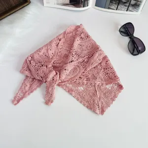 Detailed view of the pink crochet triangle scarf, featuring delicate lace knit pattern style.