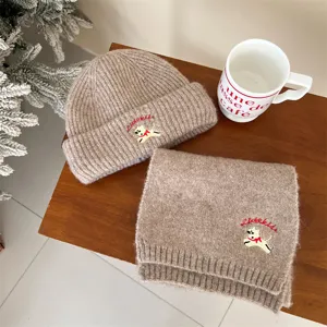 Cozy baby knit beanie and scarf set in warm camel color featuring cute puppy embroidery.