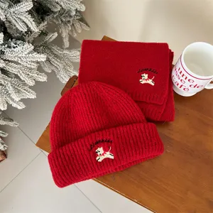 Cozy red knit baby hat and scarf set with cute puppy embroidery, warm winter children's wear.