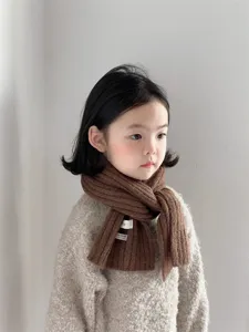 Kids winter warm knitted scarf with small label, soft and cute brown wool neck warmer.