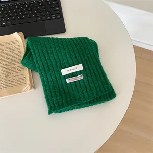 Kids winter warm green knitted scarf with cute cloth label, soft and cozy daily wear.