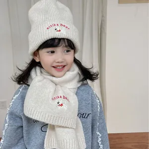 Cute kids knit beanie hat and scarf set with cute puppy embroidery for autumn and winter warmth.