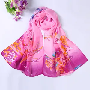 Detail view of women spring summer pink gradient floral print chiffon scarf shawl fabric texture.