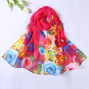 Close-up detail view of the vibrant fuchsia floral printed chiffon scarf, showcasing fine print.