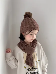 Kids brown knitted pom-pom hat and scarf set, warm winter wool beanie for toddlers boys and girls.