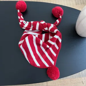 Red white striped kids knitted scarf with pom-pom details, warm winter children winter bib view.