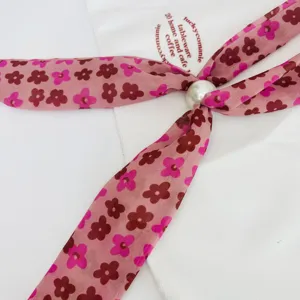 Pink floral ribbon scarf with pearl bead accent, vintage style necktie and fashion accessory.