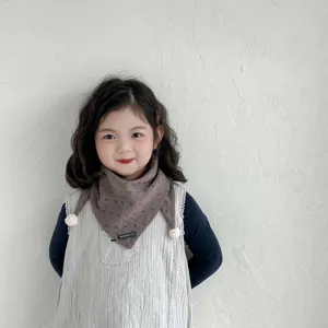 Warm toddler triangle scarf with cute pom pom accents, perfect autumn and winter baby neck warmer.
