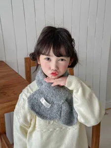 Children solid color cross scarf cozy fuzzy neck warmer winter kids scarf detail view