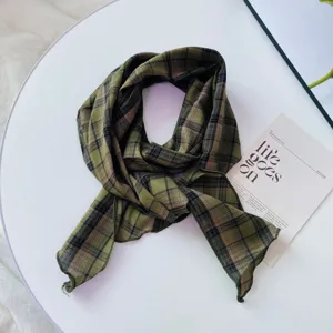 Retro plaid scarf detail view, elegant green patterned neckerchief for stylish women.