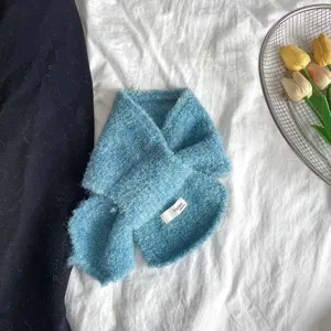 Kids blue crossed loop scarf winter textured knit toddler neck warmer detail view.