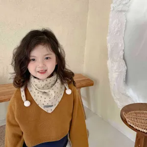 Kids winter floral triangular scarf with pom-pom details, cute warm baby bib for cold days.
