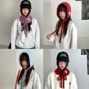 Detailed shot of the cute knitted fuzzy hood scarf, showcasing soft texture and stylish strap.
