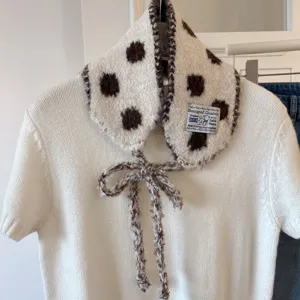 Korean style cute polka dot knitted collar scarf with bow and casual white short sleeve top.